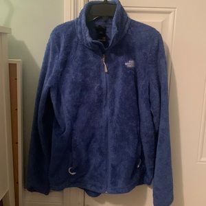 Blue fuzzy north face jacket